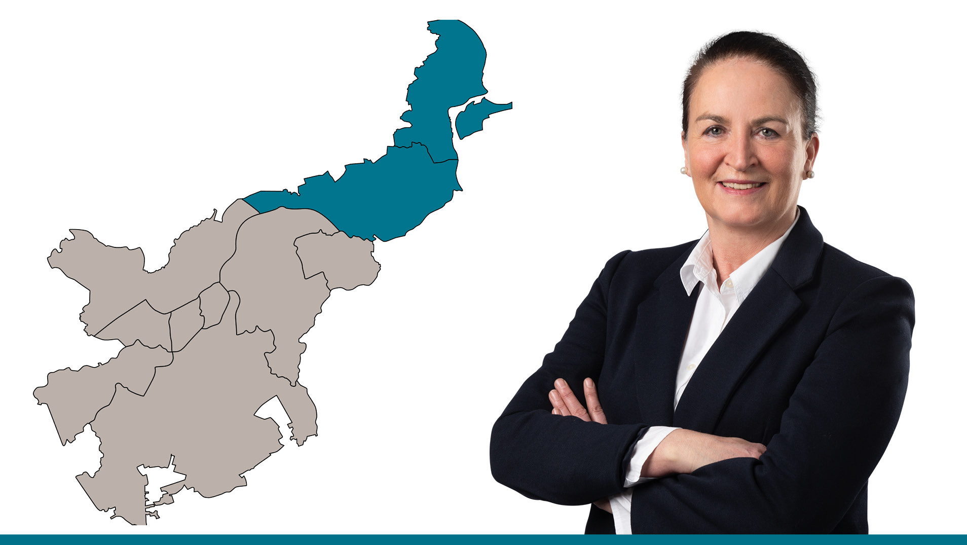 Die Ansprechpartnerin vor einer Lübeck-Karte, der Vermietungsbereich ist hervorgehoben.